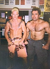 Rogan (right) posing with Gerald Strebendt in a boxing ring, 2002